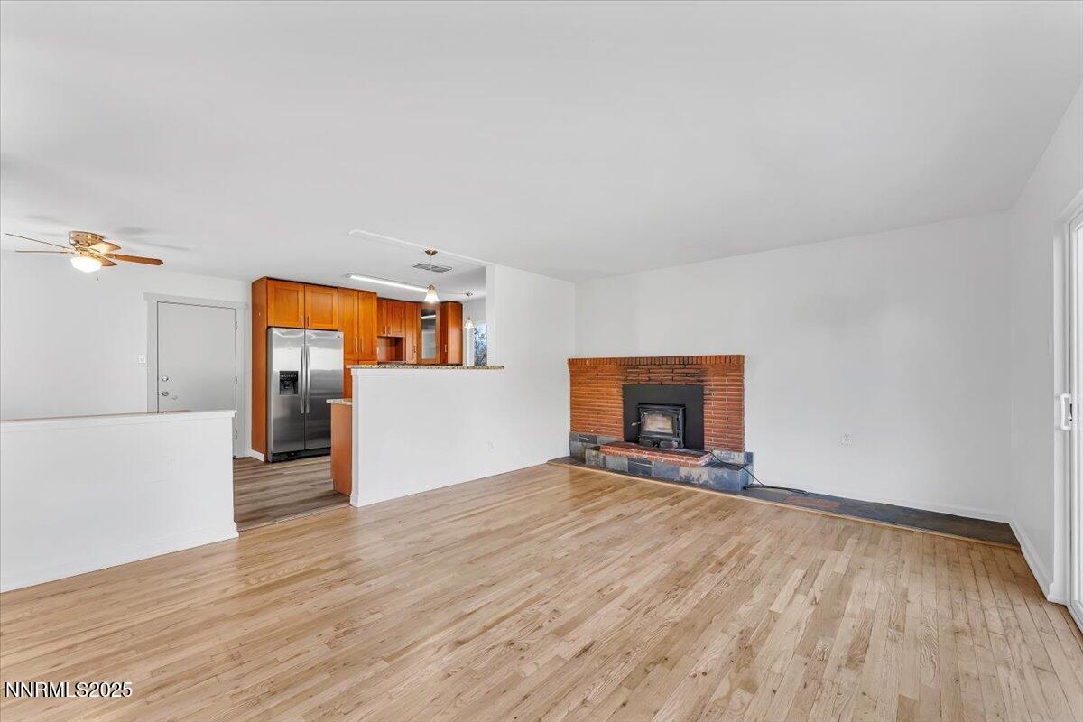 2801 Kings Row Reno, NV 89503 - Photo 8 of 32 a view of a livingroom with wooden floor and a fireplace
