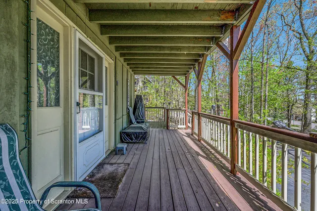a view of balcony with wooden floor