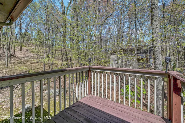 a view of balcony with wooden floor