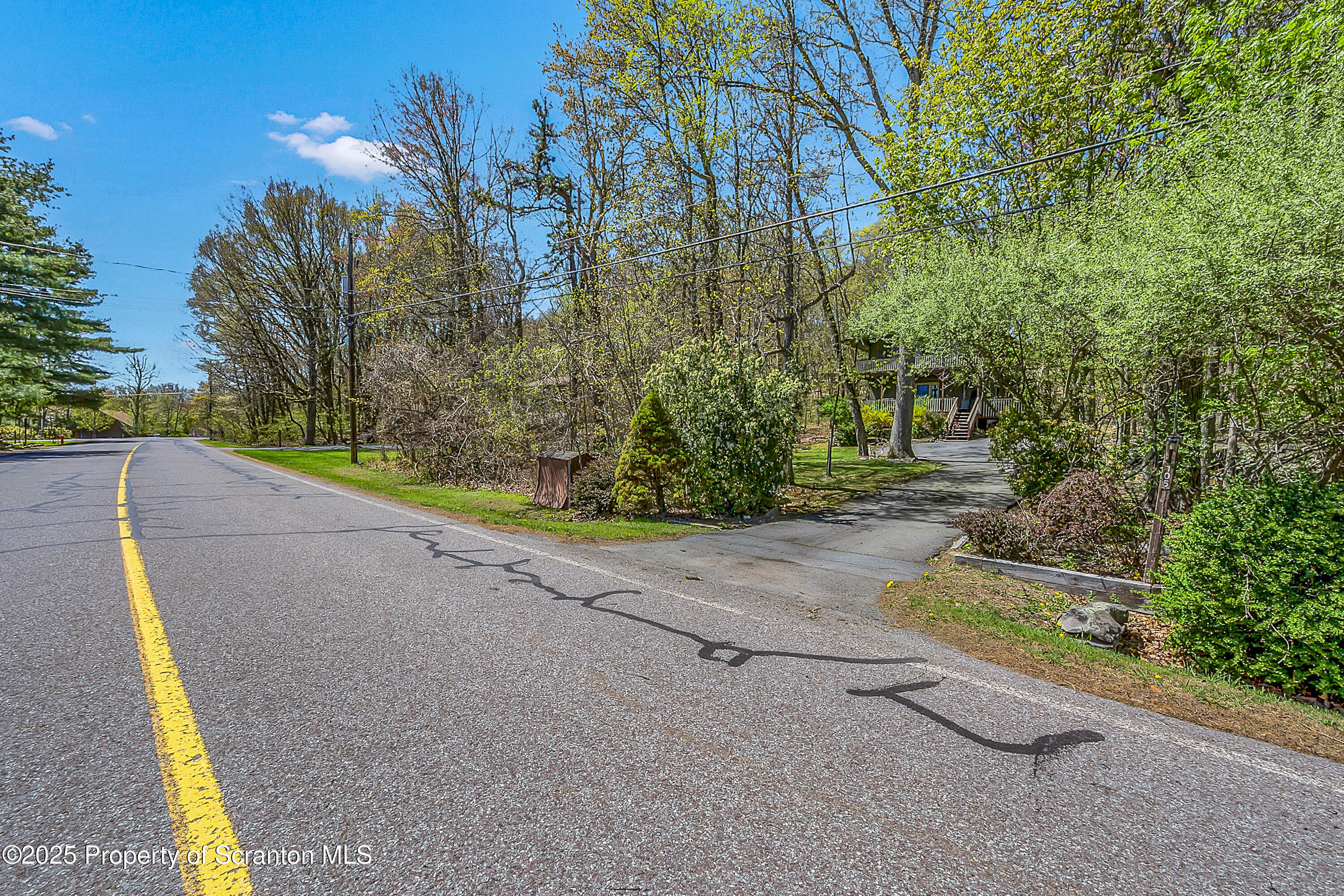 106 Lookout Drive Hawley, PA 18428 - Photo 15 of 43 a view of a road with plants and trees