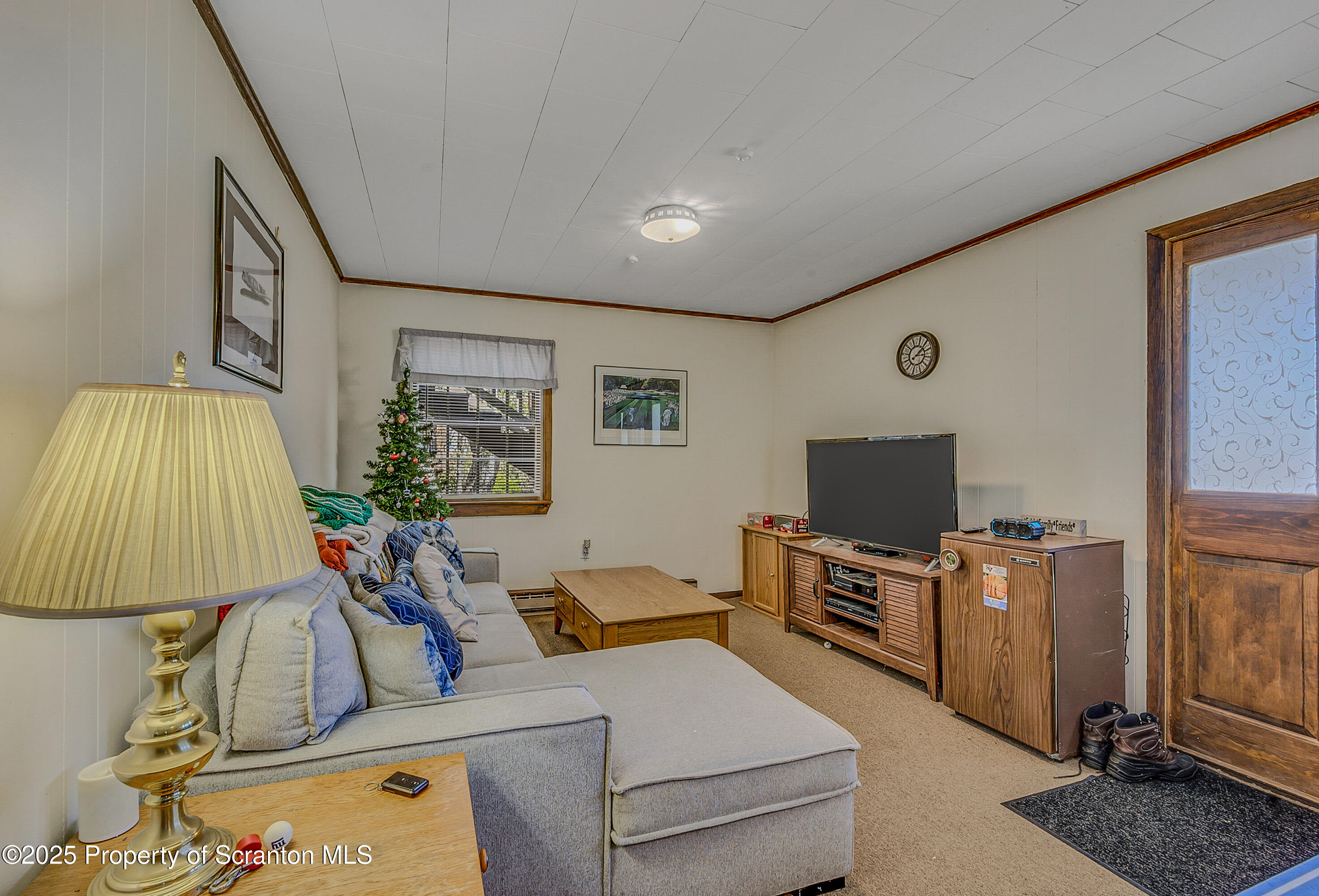 106 Lookout Drive Hawley, PA 18428 - Photo 18 of 43 a living room with furniture and a flat screen tv