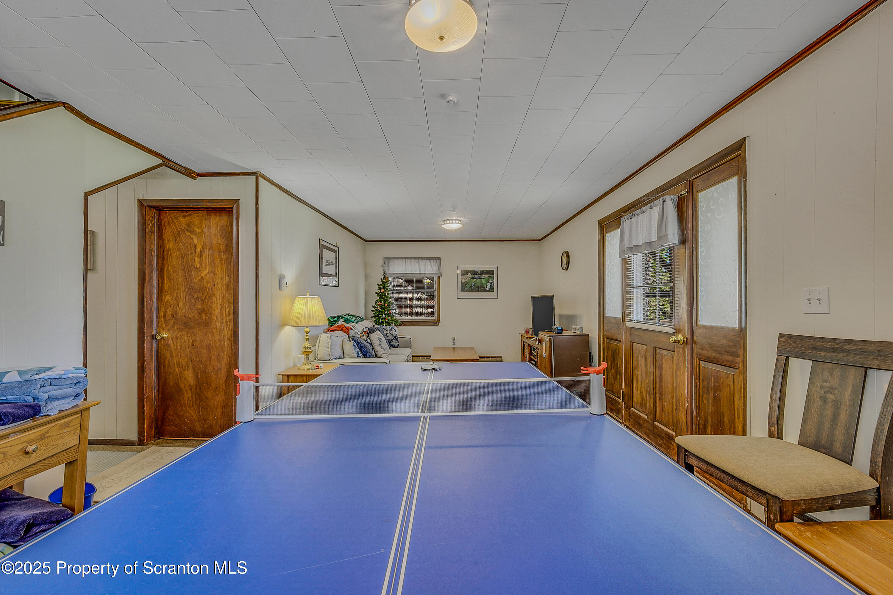 106 Lookout Drive Hawley, PA 18428 - Photo 19 of 43 a room with lots of furniture and wooden floor