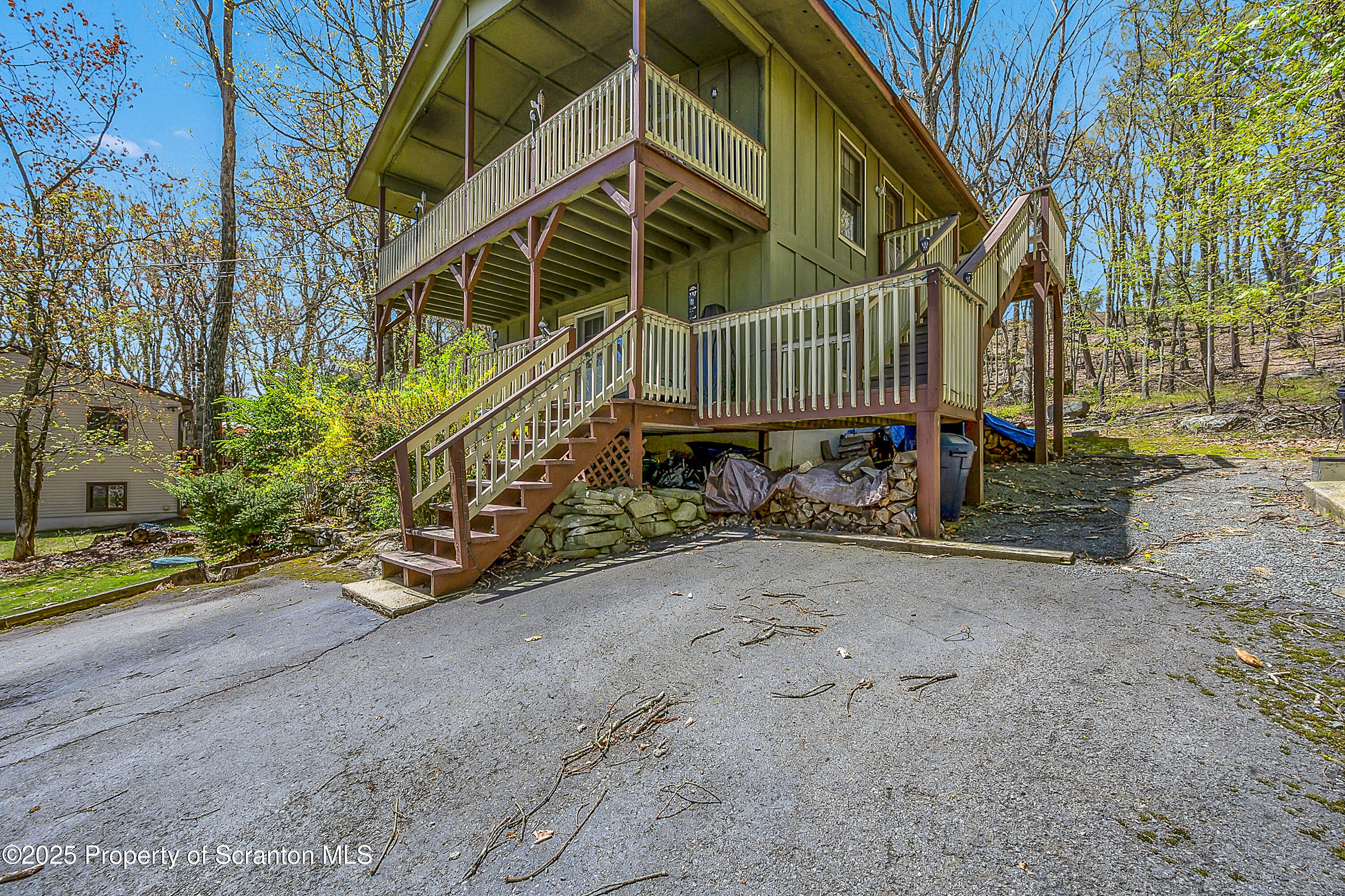 106 Lookout Drive Hawley, PA 18428 - Photo 2 of 43 a view of a chair and table in the backyard