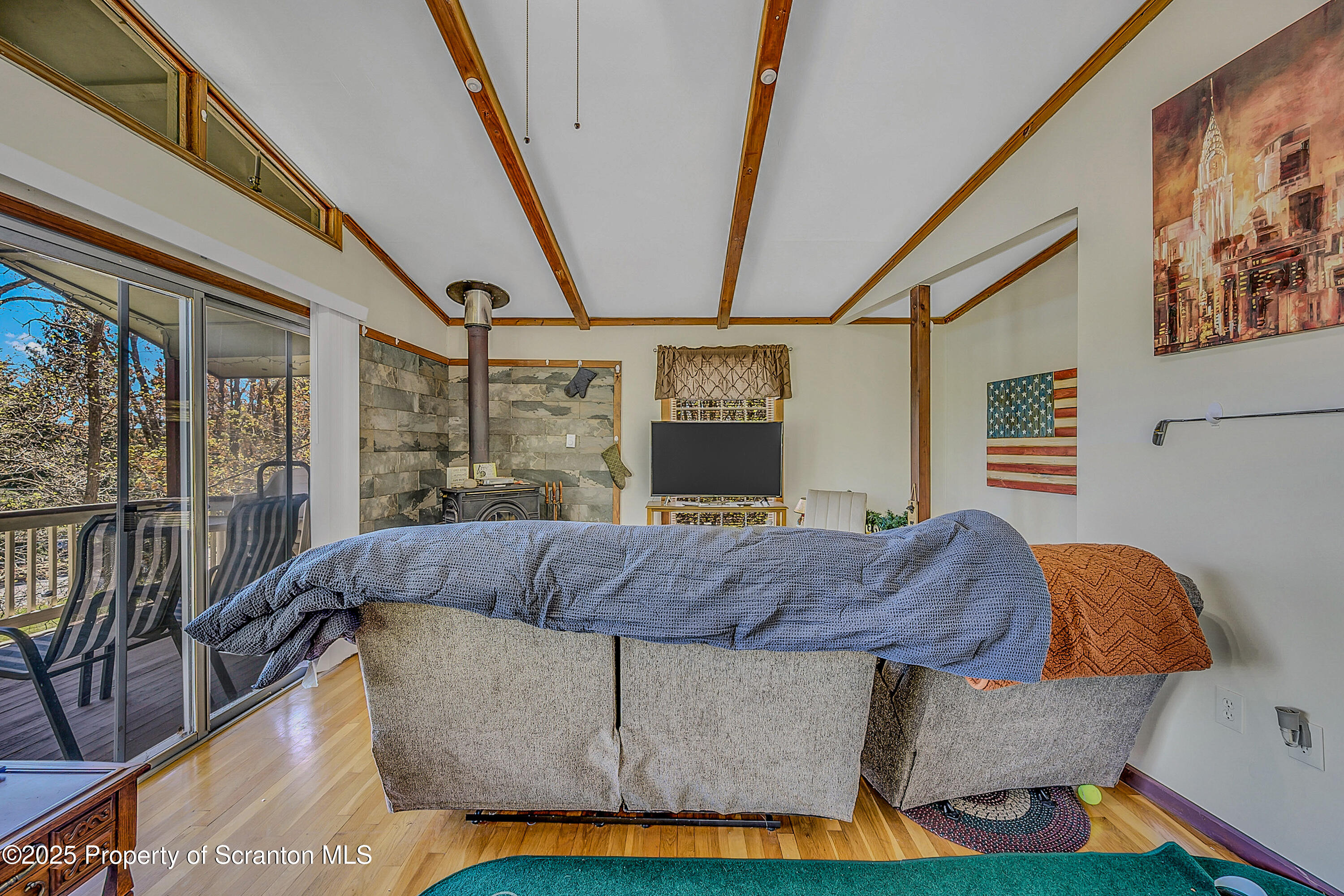 106 Lookout Drive Hawley, PA 18428 - Photo 30 of 43 a living room with a couch and a table