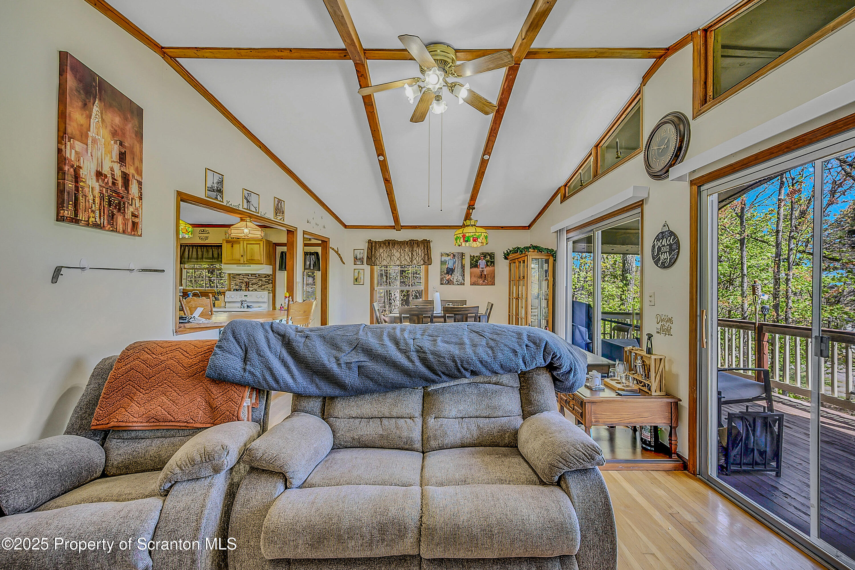 106 Lookout Drive Hawley, PA 18428 - Photo 31 of 43 a living room with furniture a couch and a floor to ceiling window