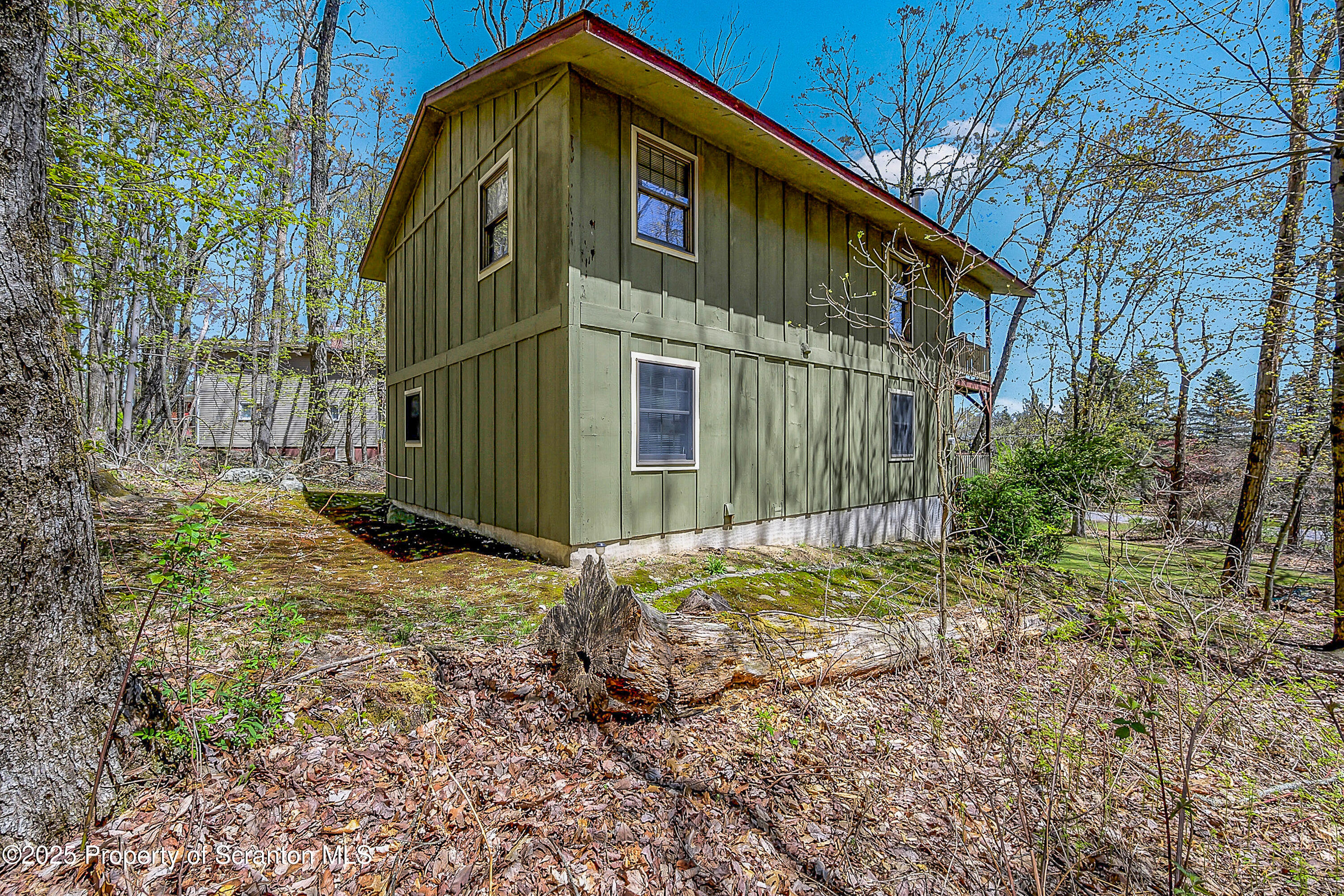 106 Lookout Drive Hawley, PA 18428 - Photo 4 of 43 a front view of a house with garden