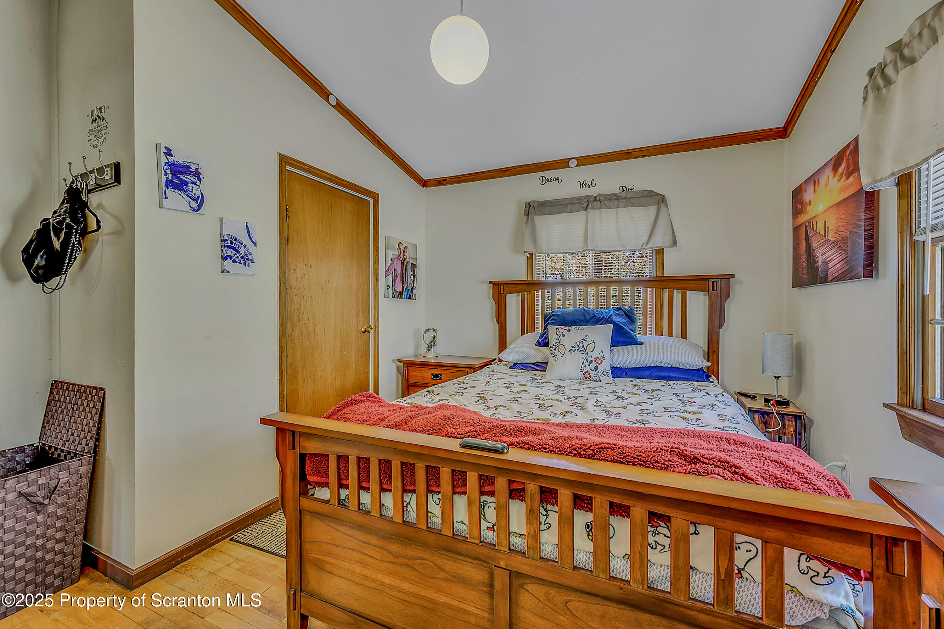 106 Lookout Drive Hawley, PA 18428 - Photo 43 of 43 a bedroom with a bed and wooden floor