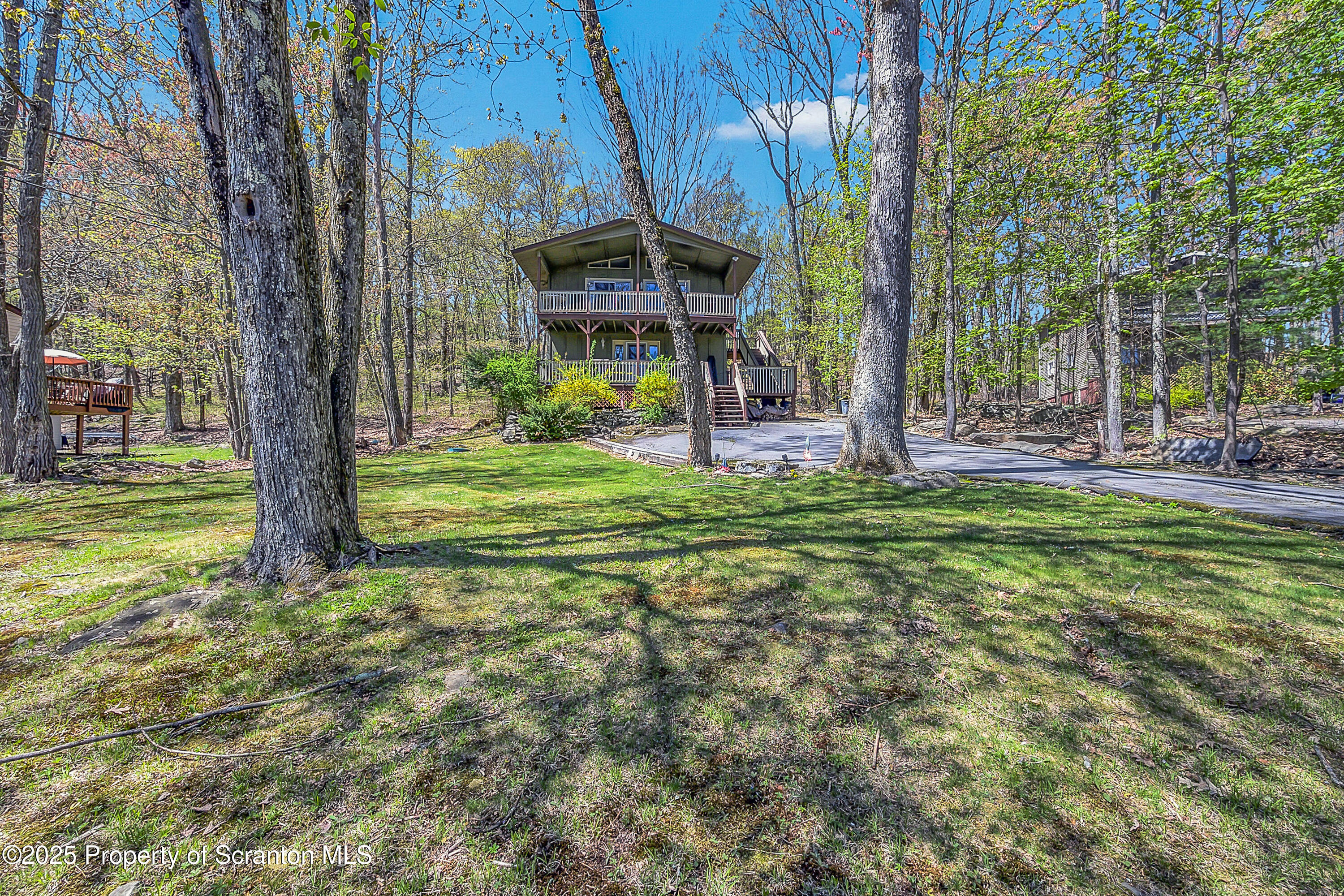 106 Lookout Drive Hawley, PA 18428 - Photo 7 of 43 a view of a house with backyard and sitting area