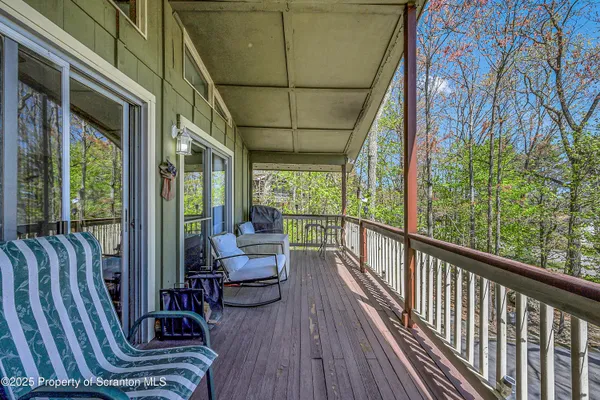 a view of balcony with furniture