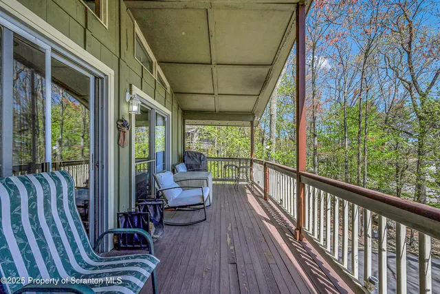 a view of balcony with furniture