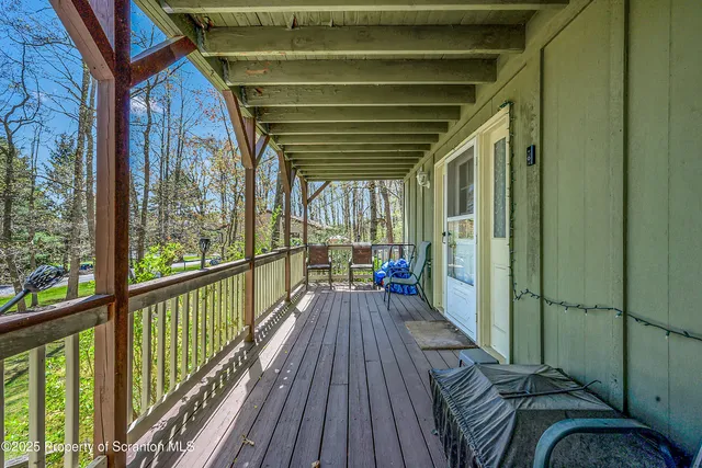 a view of a balcony with wooden floor