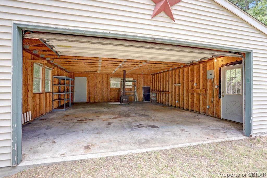 7025 Mumford Cove Road Hayes, VA 23072 - Photo 43 of 43 Detached garage with power and wood stove