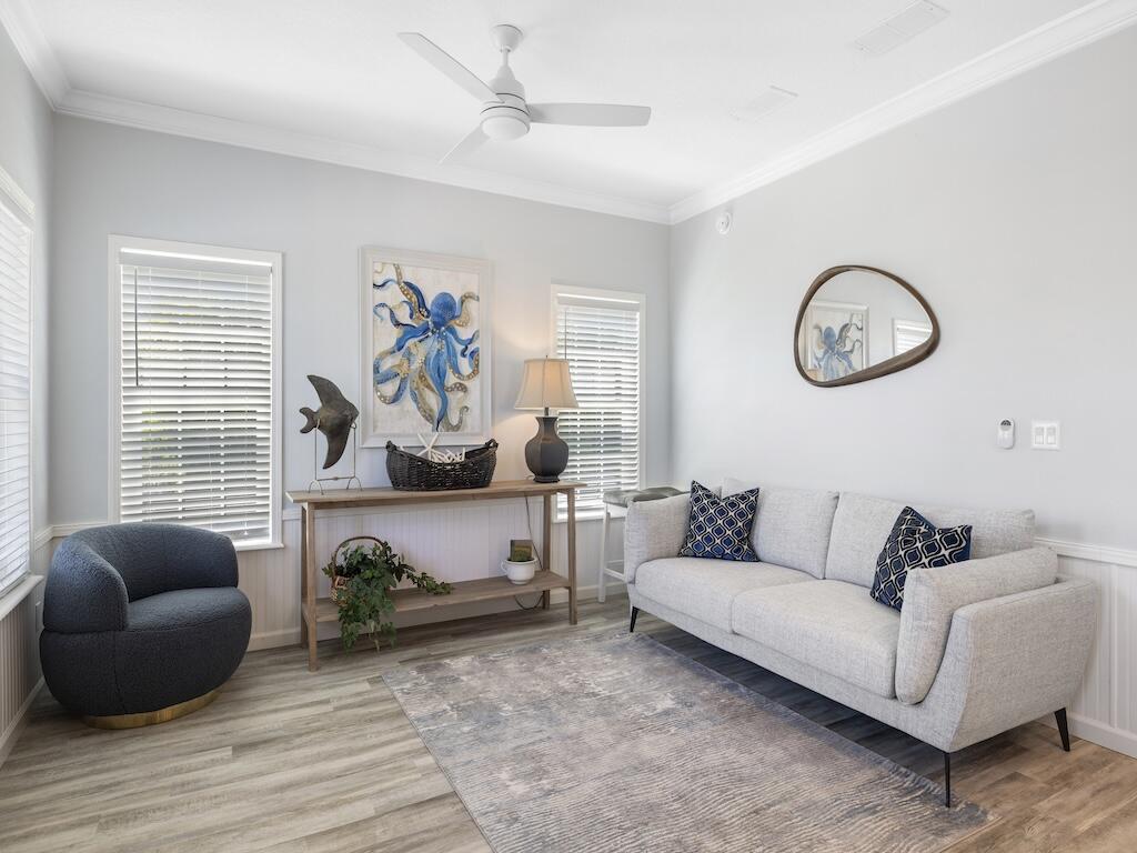 12939 North Indian River Drive, Unit 1 Sebastian, FL 32958 - Photo 15 of 46 a living room with furniture and a wooden floor