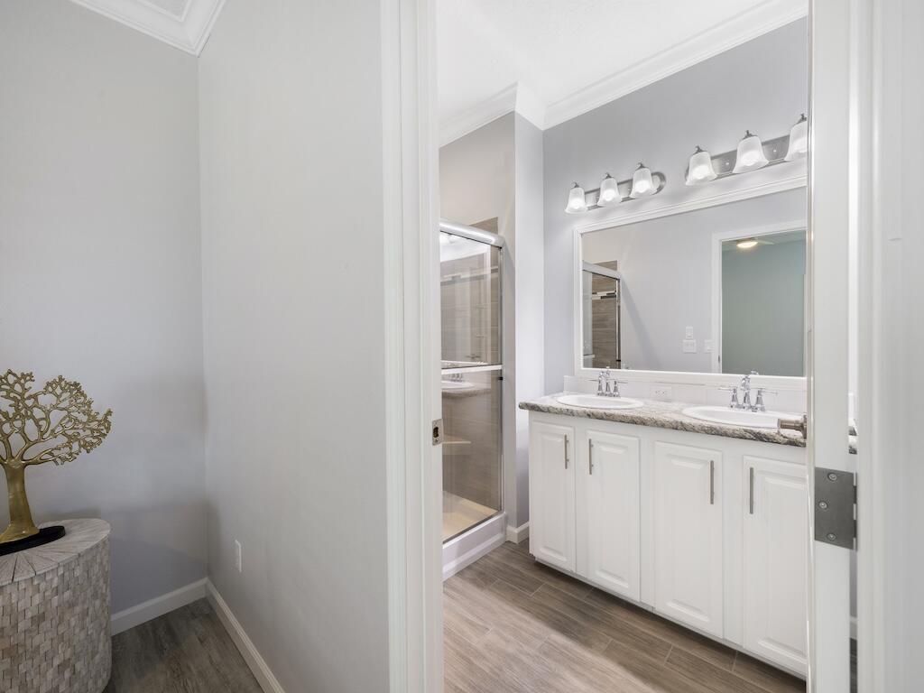 12939 North Indian River Drive, Unit 1 Sebastian, FL 32958 - Photo 23 of 46 a bathroom with a sink and a mirror