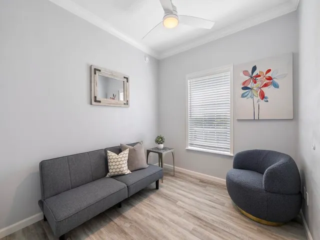 a living room with furniture and a window