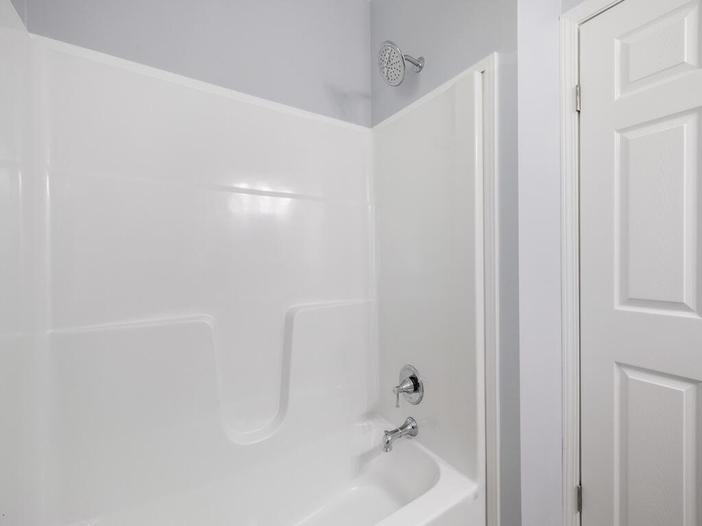 12939 North Indian River Drive, Unit 1 Sebastian, FL 32958 - Photo 29 of 46 a bathroom with a bathtub and shower