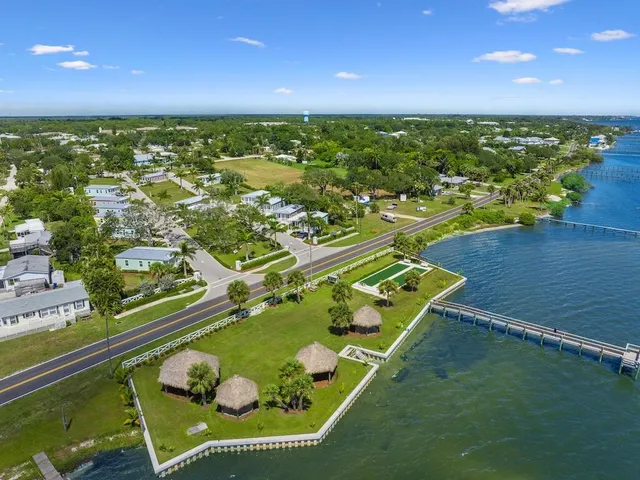 an aerial view of a pool patio swimming pool and outdoor seating