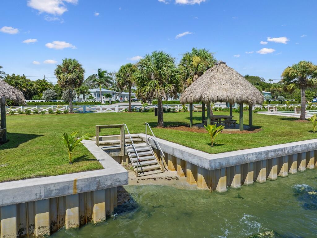 12939 North Indian River Drive, Unit 1 Sebastian, FL 32958 - Photo 32 of 46 a view of a house with a yard