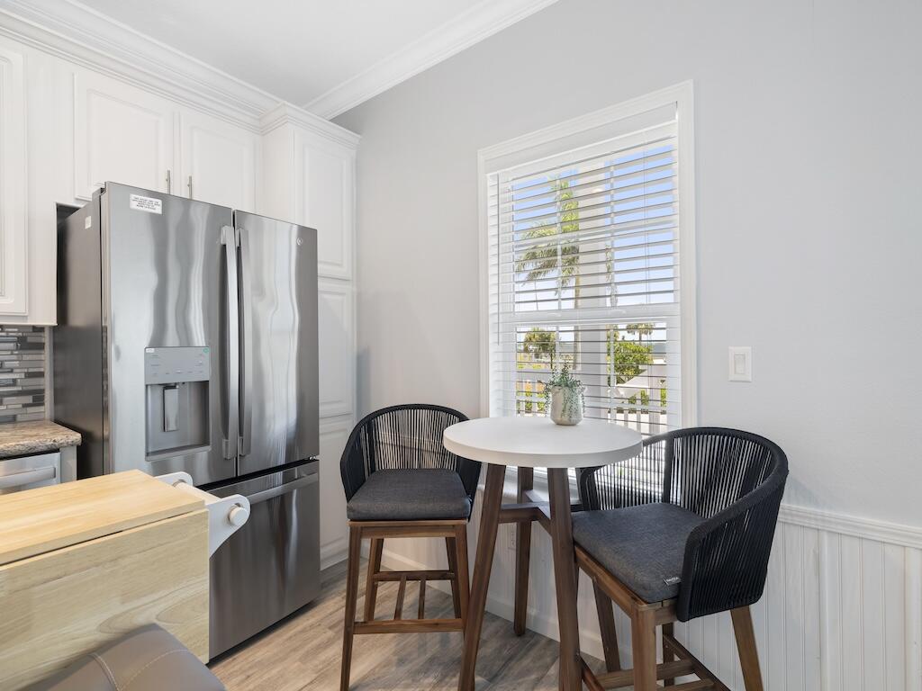 12939 North Indian River Drive, Unit 1 Sebastian, FL 32958 - Photo 10 of 46 a dining room with furniture and window