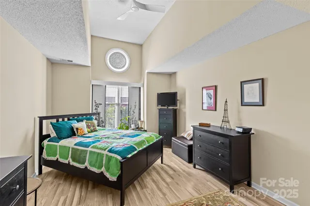 a bedroom with a bed and a table