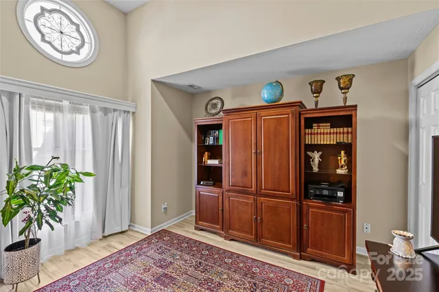 a view of an entryway with wooden floor