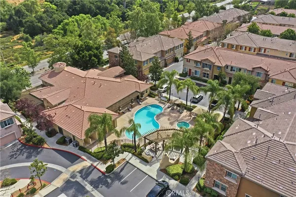 an aerial view of residential houses with outdoor space