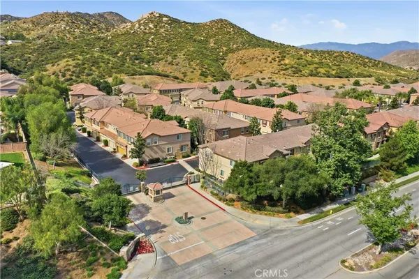 an aerial view of residential houses with outdoor space