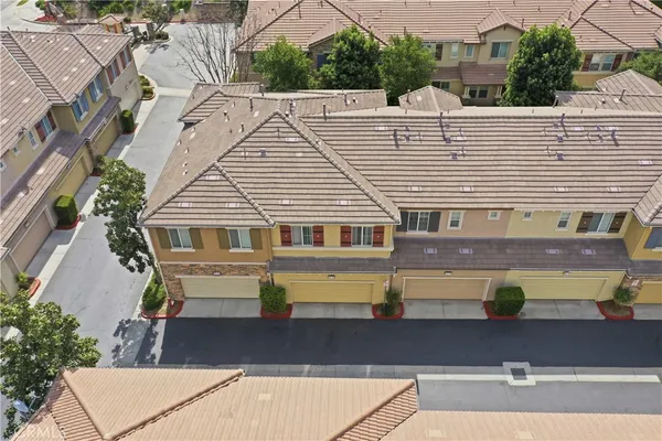 an aerial view of a house with a swimming pool