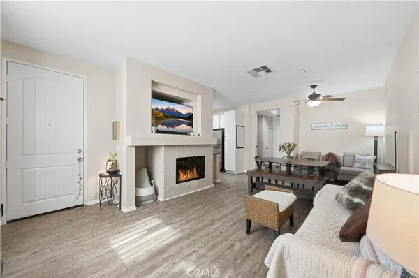 a living room with furniture and a fireplace