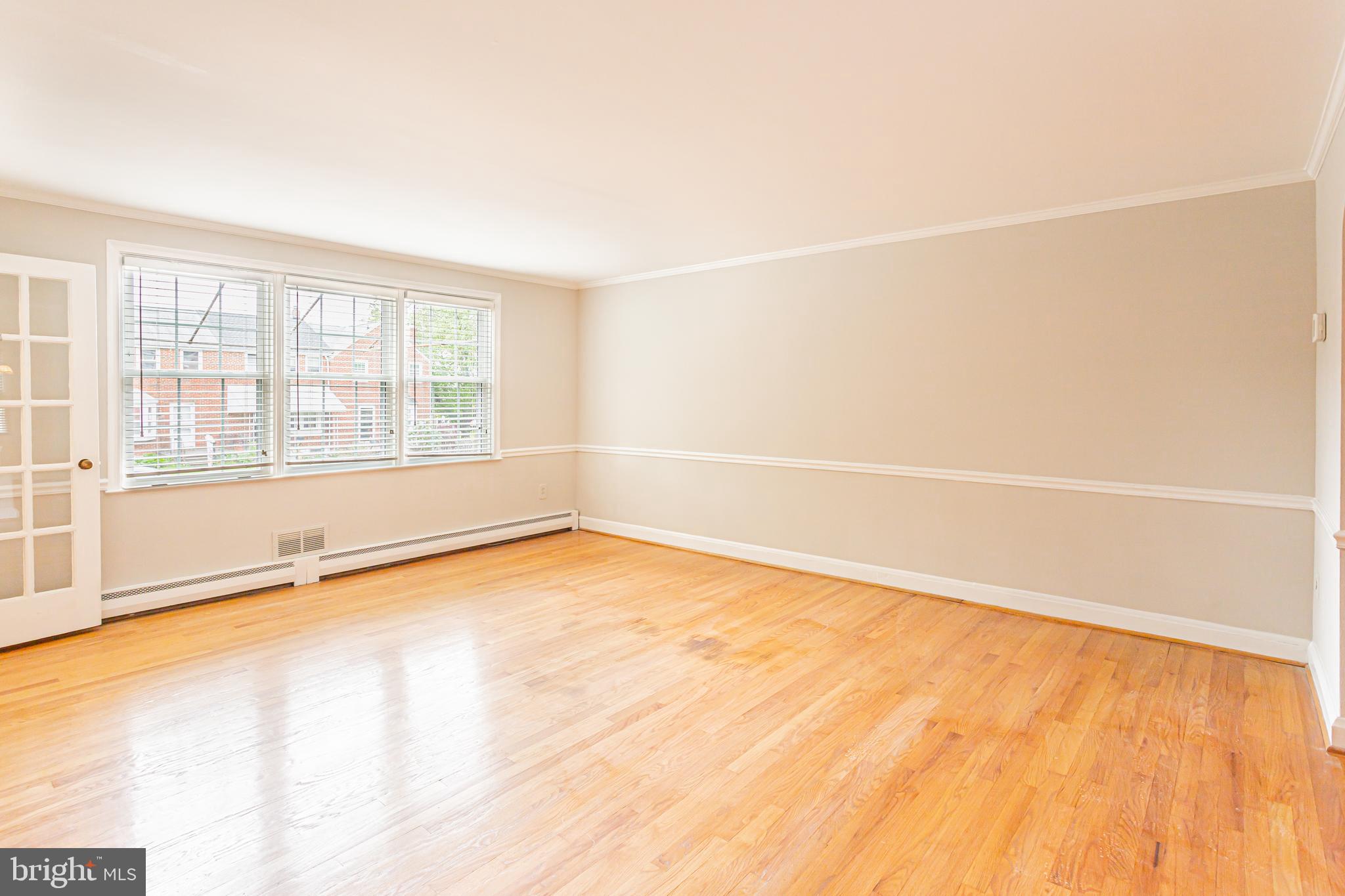 8426 Pleasant Plains Road Towson, MD 21286 - Photo 2 of 25 Open Living room with beautiful hardwood floors