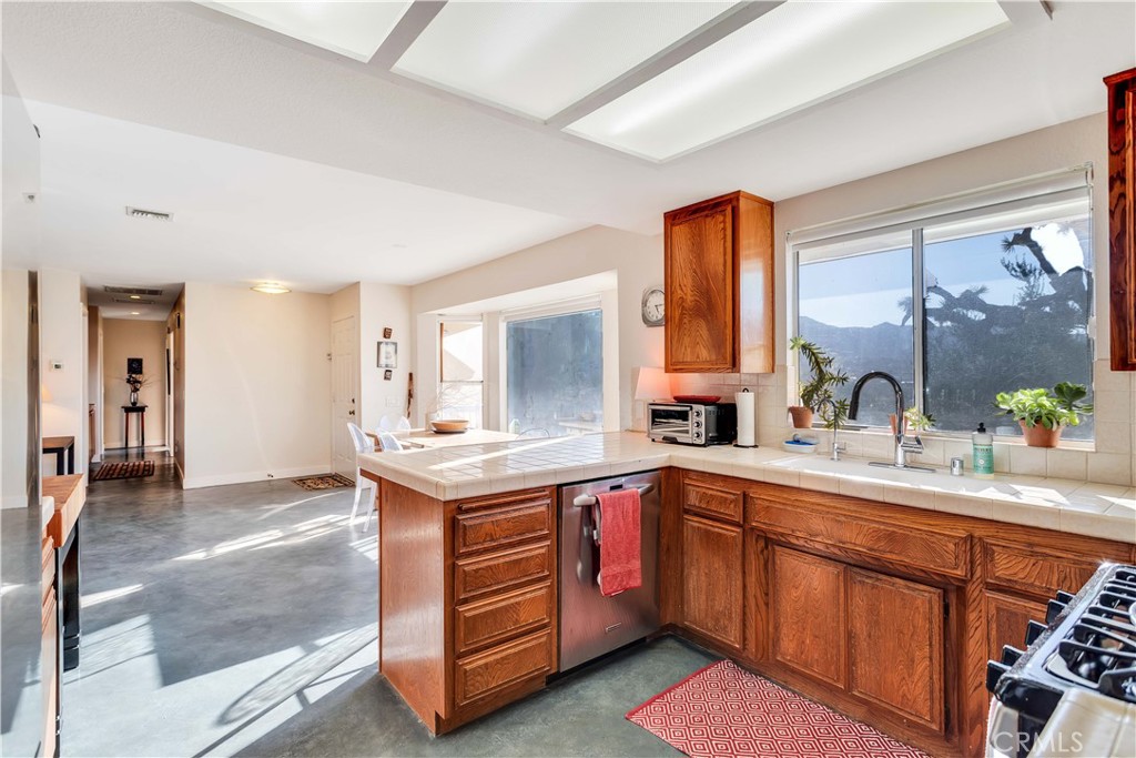 8775 Desert Shadow Road Joshua Tree, CA 92252 - Photo 15 of 39 a kitchen with a sink and cabinets