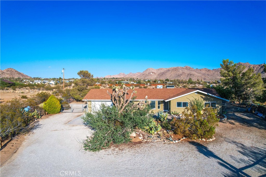 8775 Desert Shadow Road Joshua Tree, CA 92252 - Photo 2 of 39 an aerial view of multiple house