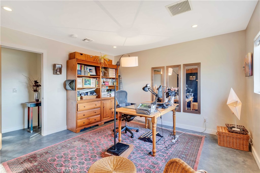 8775 Desert Shadow Road Joshua Tree, CA 92252 - Photo 23 of 39 a workspace with furniture