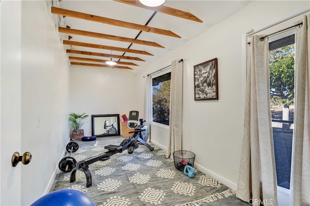 8775 Desert Shadow Road Joshua Tree, CA 92252 - Photo 25 of 39 a view of a room with gym equipment