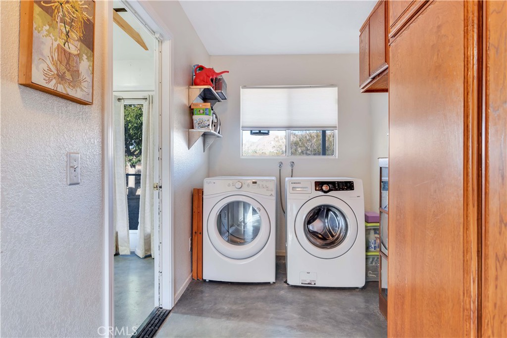 8775 Desert Shadow Road Joshua Tree, CA 92252 - Photo 28 of 39 a utility room with dryer and washer