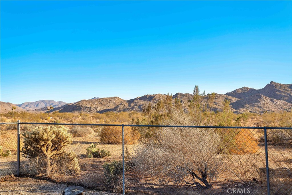 8775 Desert Shadow Road Joshua Tree, CA 92252 - Photo 34 of 39 a view of a city with a mountain