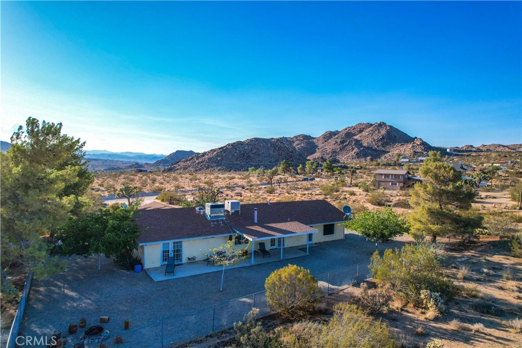 8775 Desert Shadow Road Joshua Tree, CA 92252 - Photo 36 of 39 an aerial view of a house with a mountain