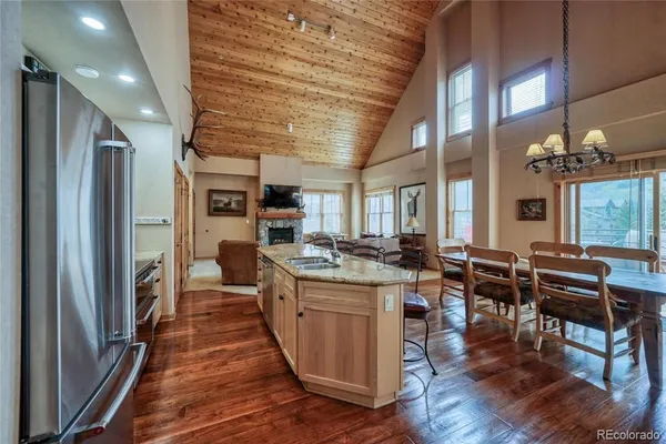 a kitchen with lots of counter top space and furniture