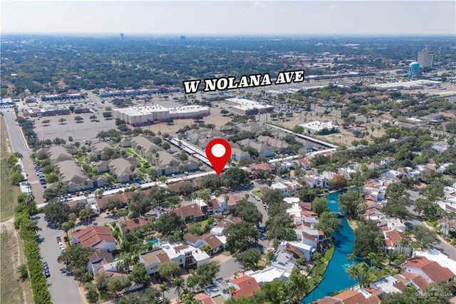 an aerial view of city and lake