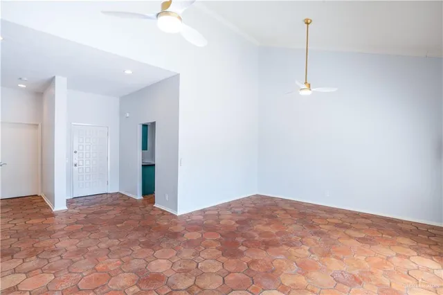 a view of an empty room with a fan
