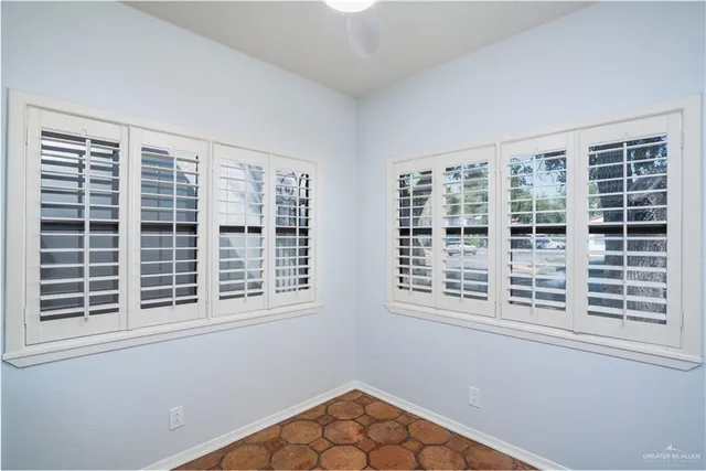 a view of empty room with windows