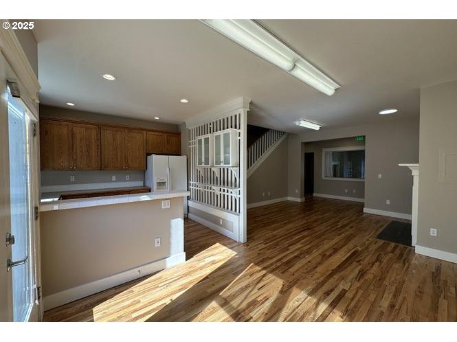 1495 Northeast Village Street Fairview, OR 97024 - Photo 5 of 16 a view of kitchen with wooden floor