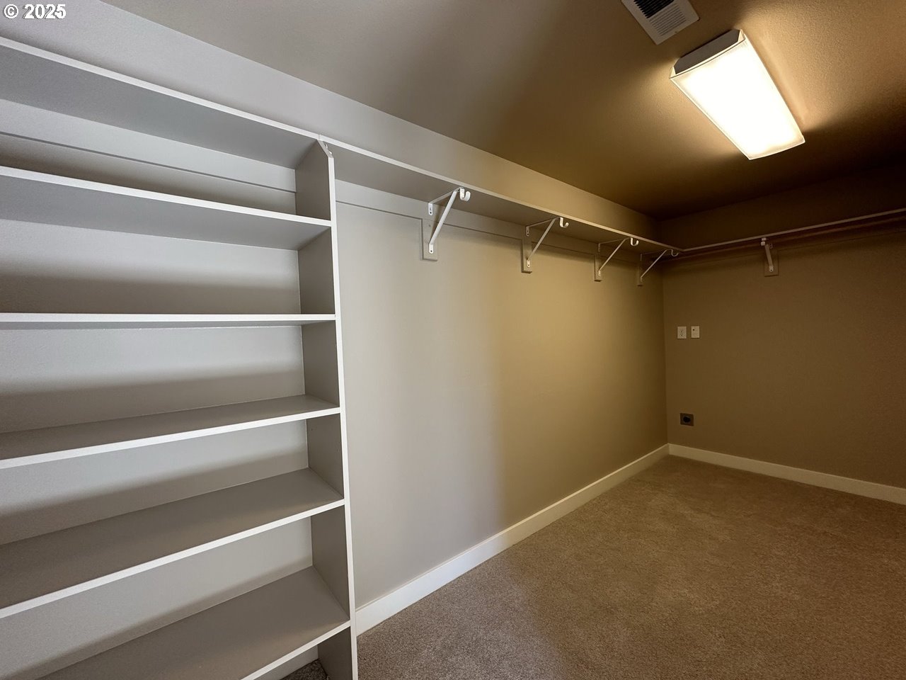 1495 Northeast Village Street Fairview, OR 97024 - Photo 10 of 16 a view of walk in closet with empty racks