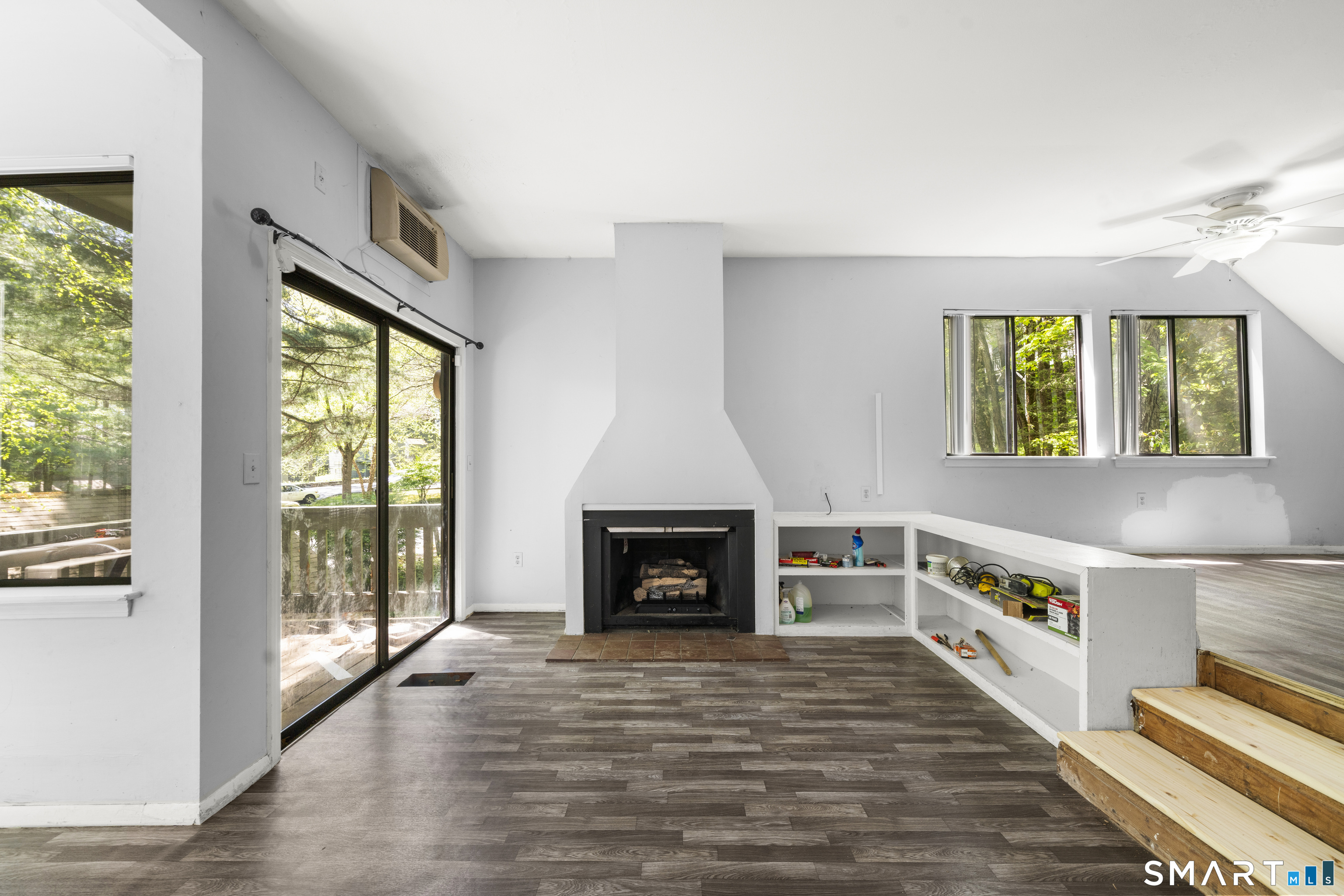 39 Evergreen Road, Unit 39 Torrington, CT 06790 - Photo 7 of 27 a view of an empty room with window and fire place