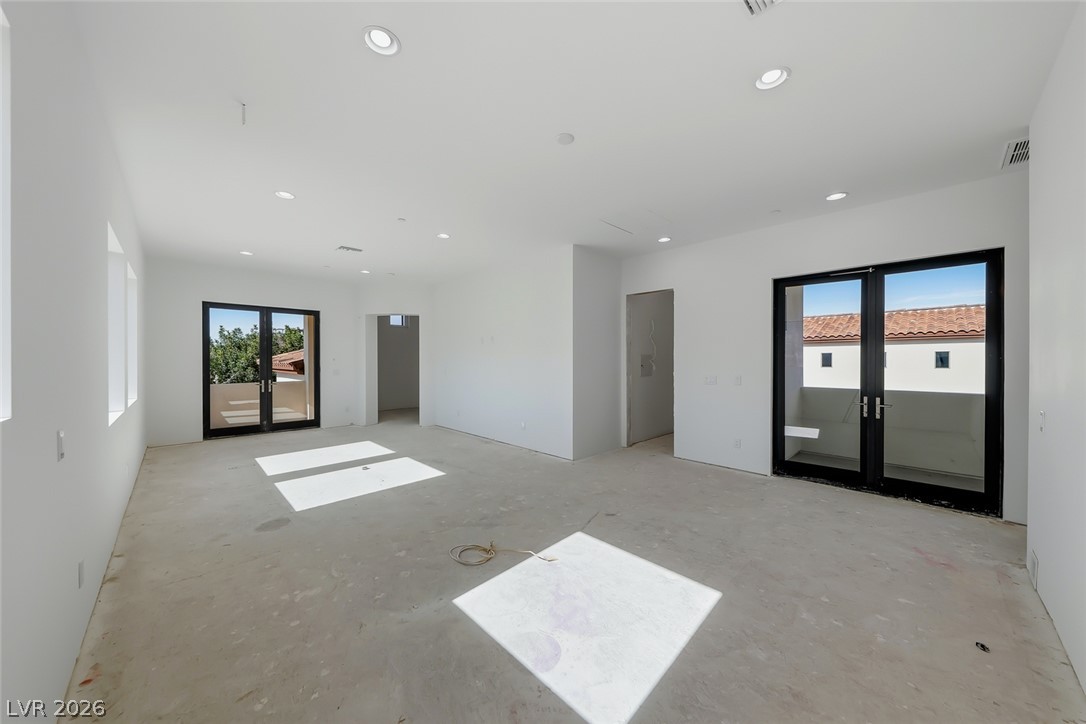 1140 Julie Road Henderson, NV 89002 - Photo 53 of 71 Sun-drenched interiors flow onto a private balcony, offering potential for seamless indoor-outdoor living.