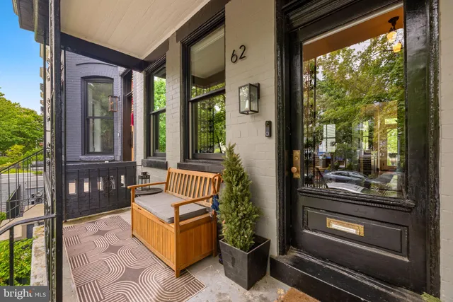 a outdoor living space with patio furniture and garden view
