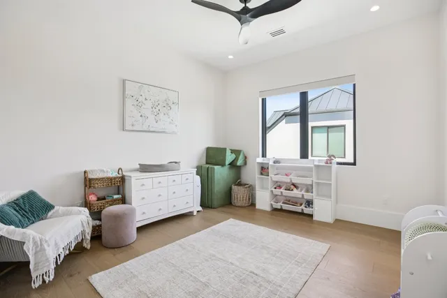 a bedroom with furniture and a window