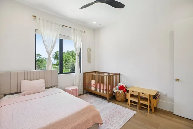 a bedroom with furniture and a window