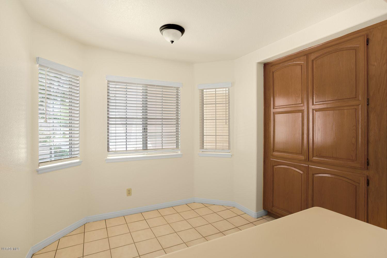2188 Eastridge Loop Oxnard, CA 93036 - Photo 11 of 27 a bedroom with a bed and a window