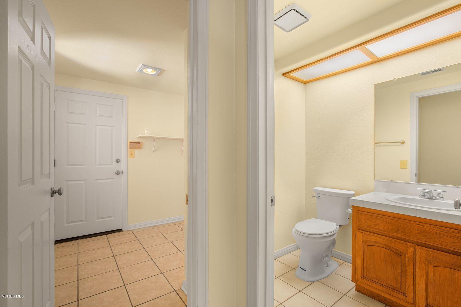 2188 Eastridge Loop Oxnard, CA 93036 - Photo 19 of 27 a bathroom with a sink a toilet and shower